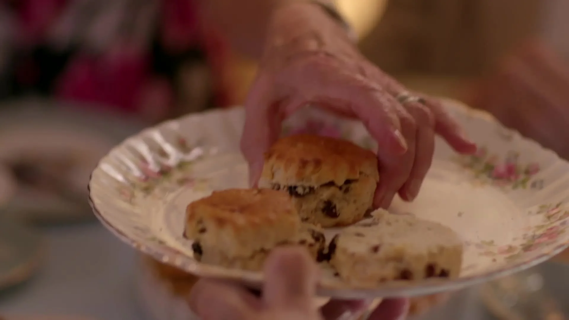 A plate of scones passed around the table