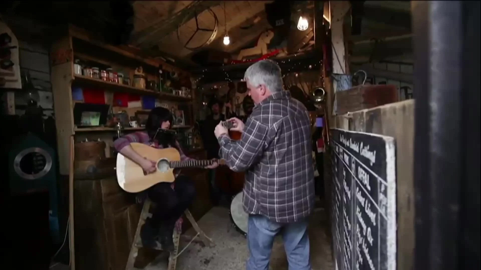 Playing guitar in the recording studio shed