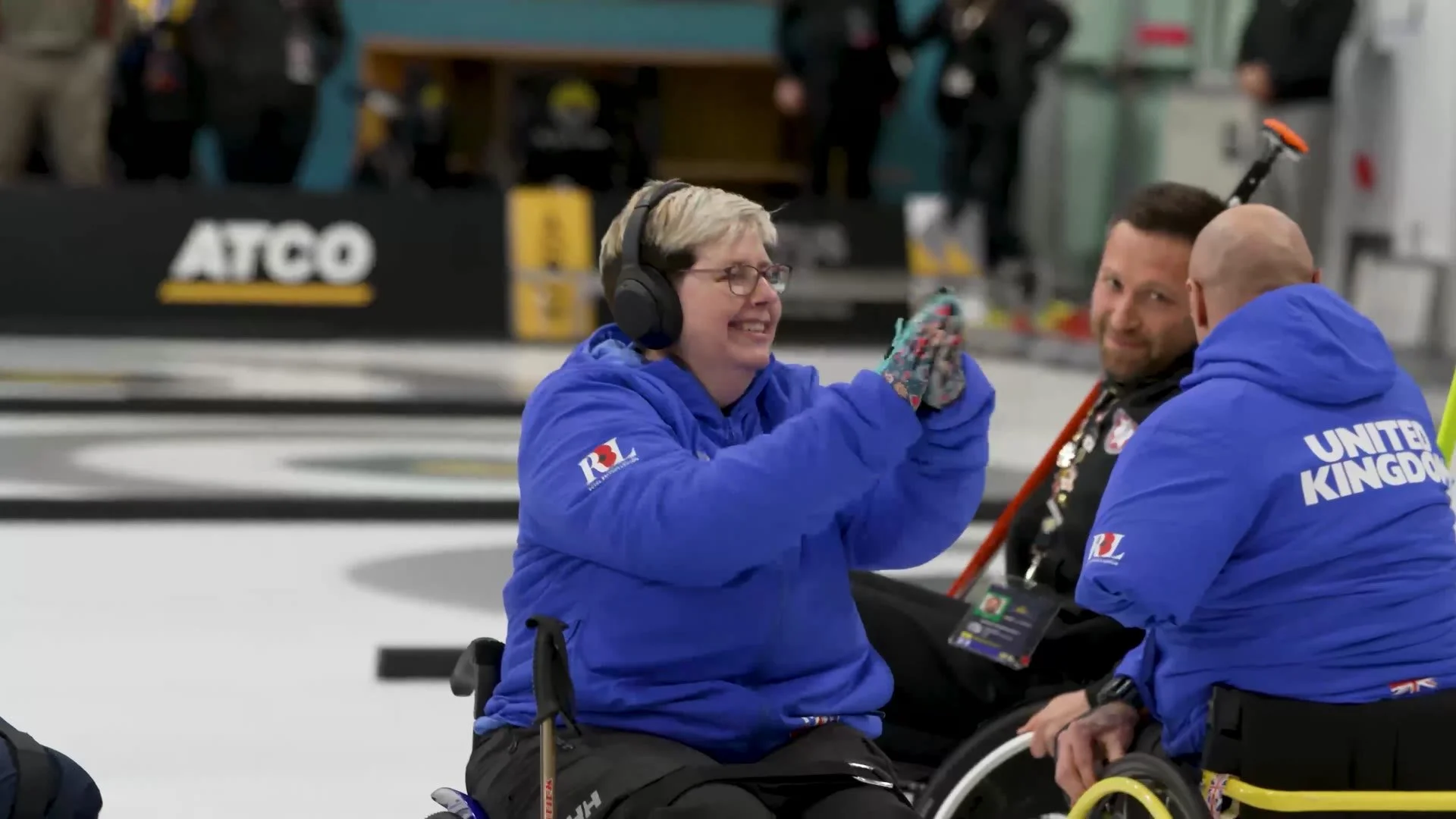 Team UK wheelchair curlers celebrating a shot