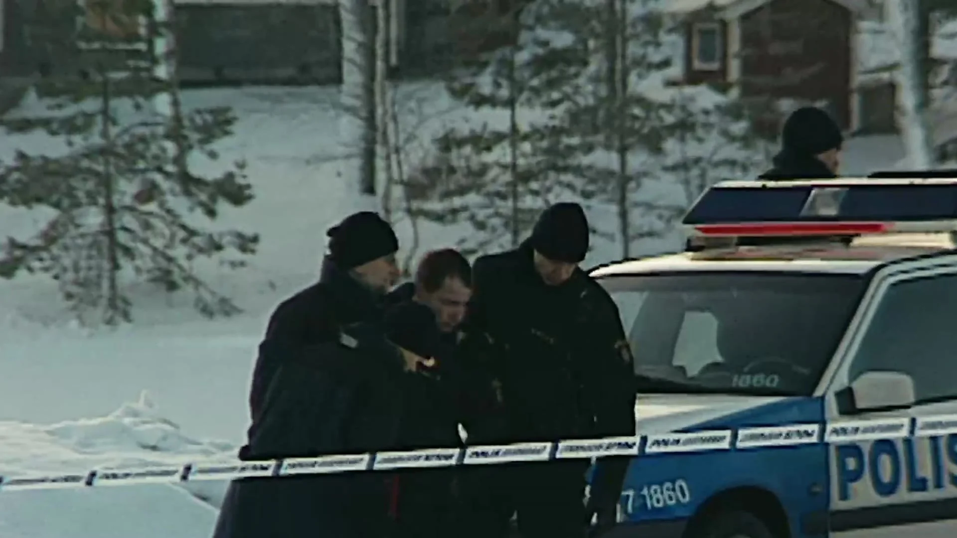 Police car and officers at a snowy scene, from the documentary trailer