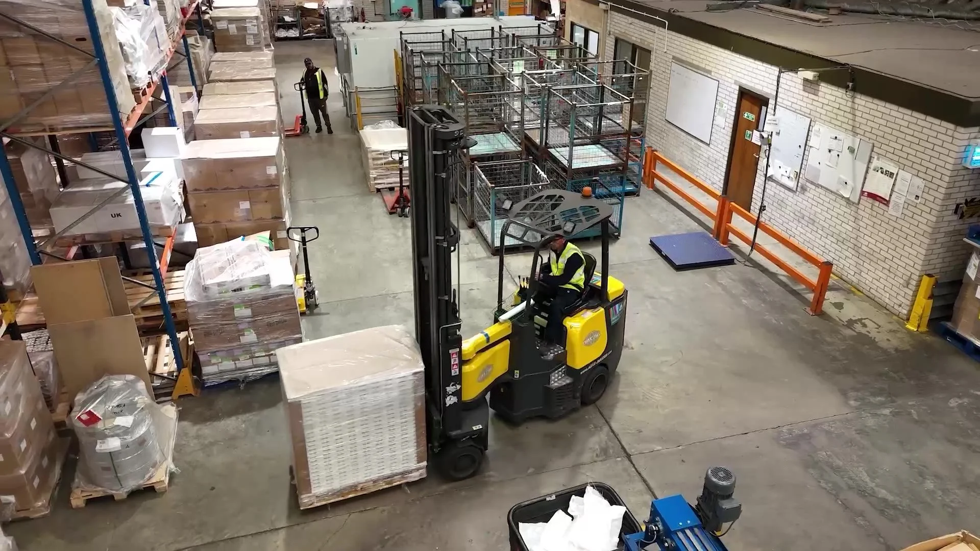 A forklift moving stock inside the warehouse