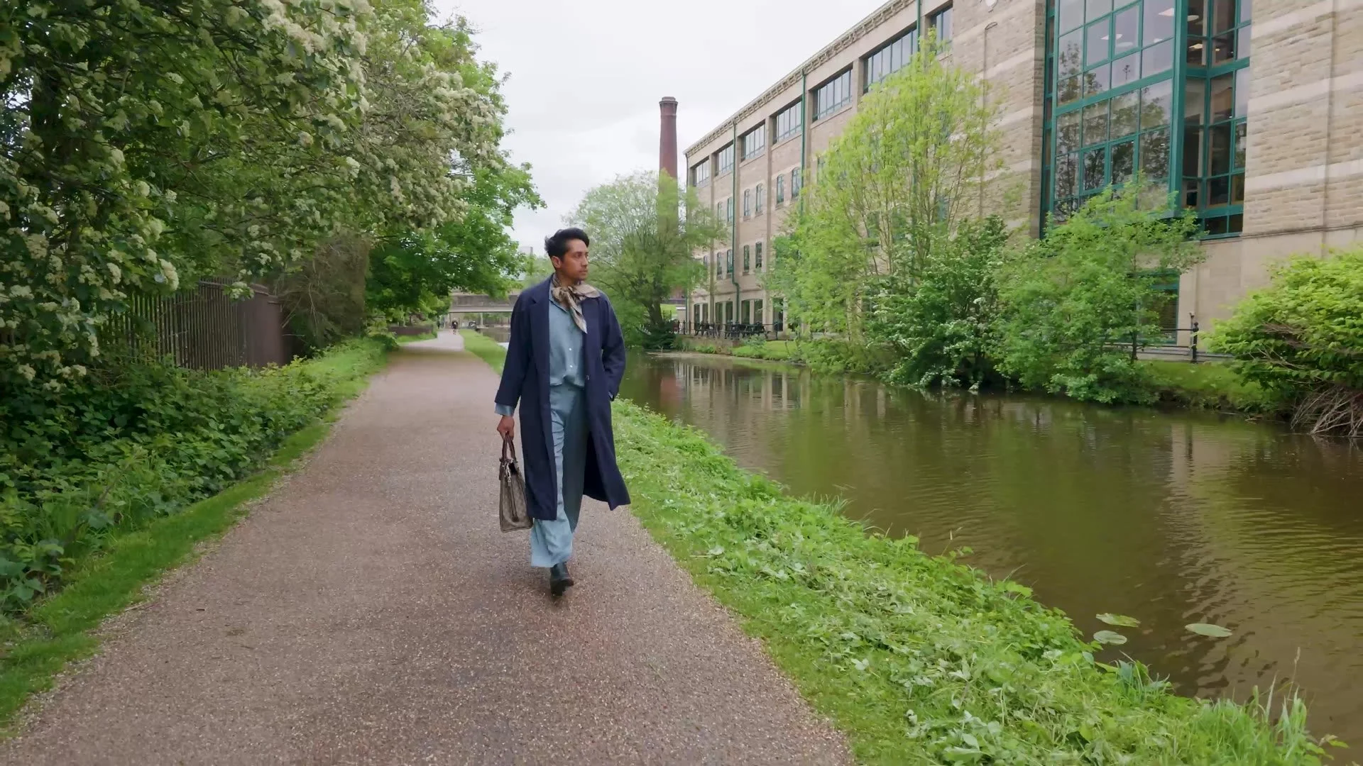Writer Kamal Kaan walking along a canal towpath