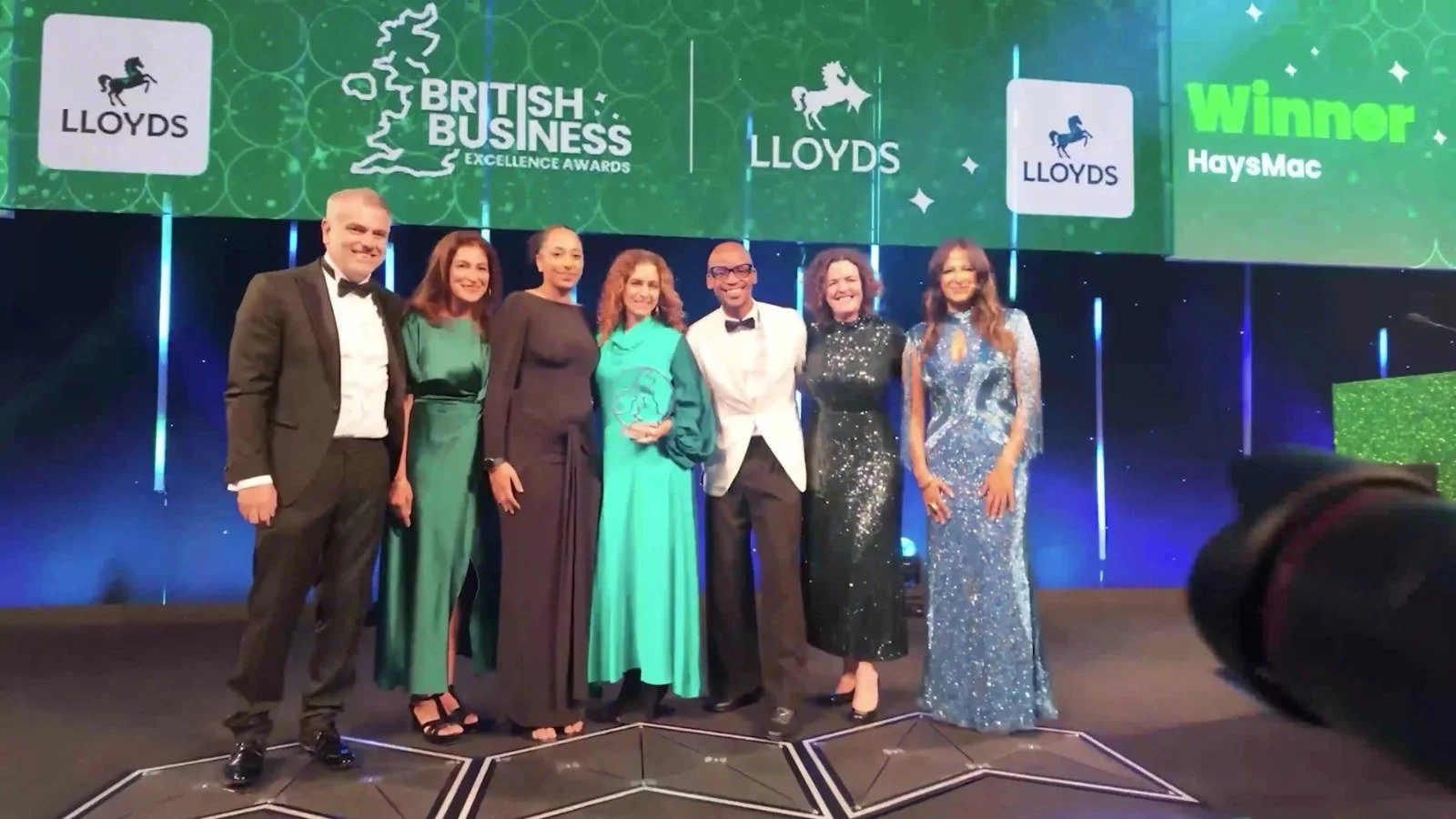 HaysMac team on stage collecting the Lloyds DE&I Champion of the Year award