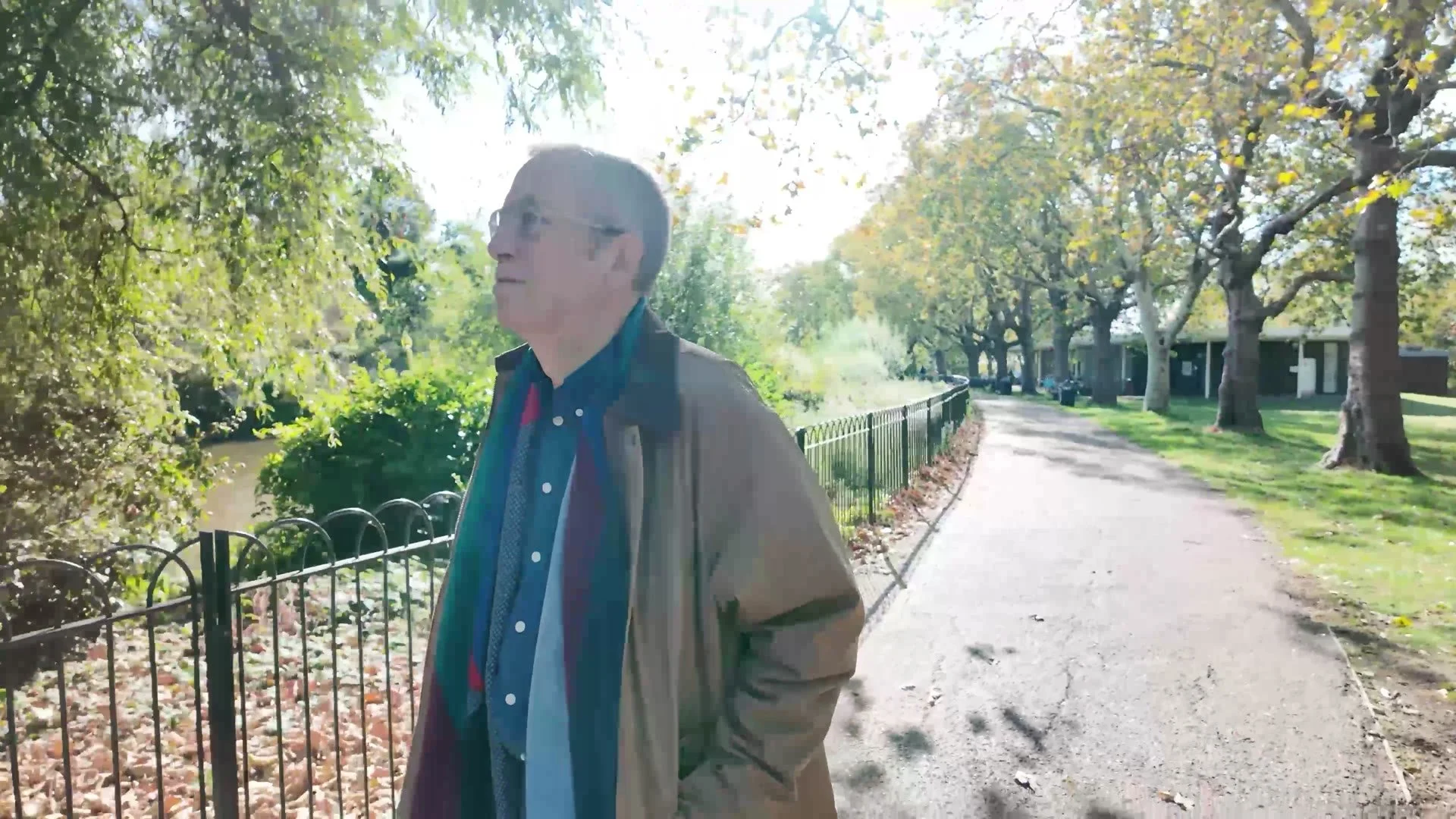 Michael on a tree-lined park path