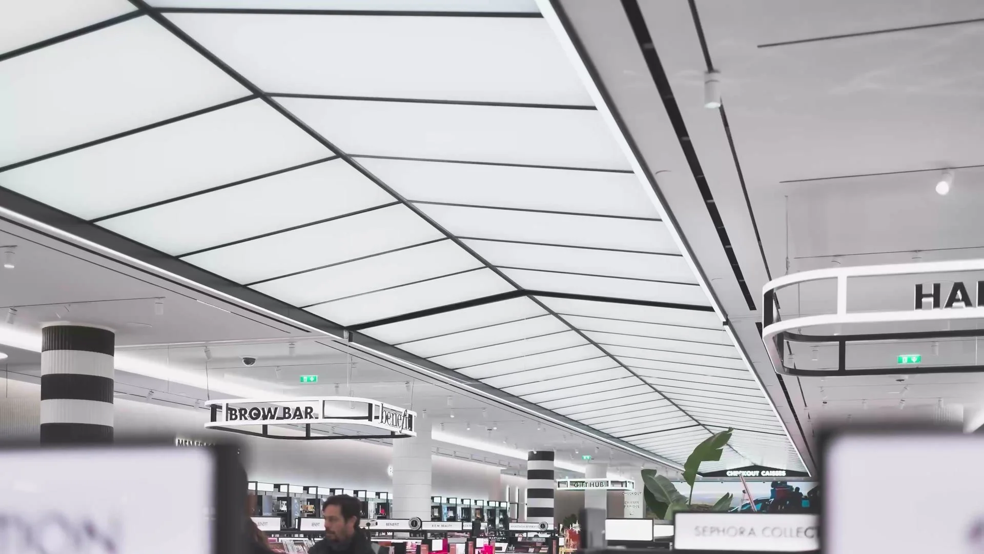Illuminated retail ceiling installation made by Unibox