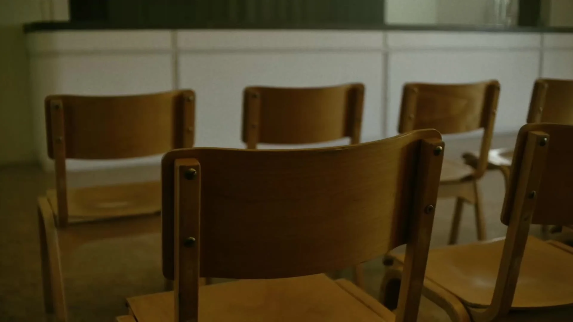 Empty church hall with rows of chairs