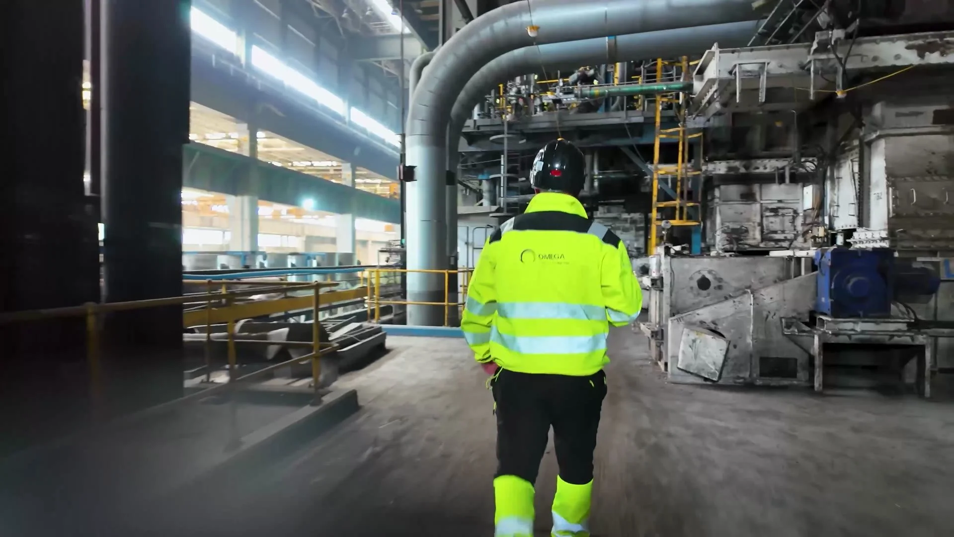 Omega Environmental Services site operative walking through Aberthaw Power Station