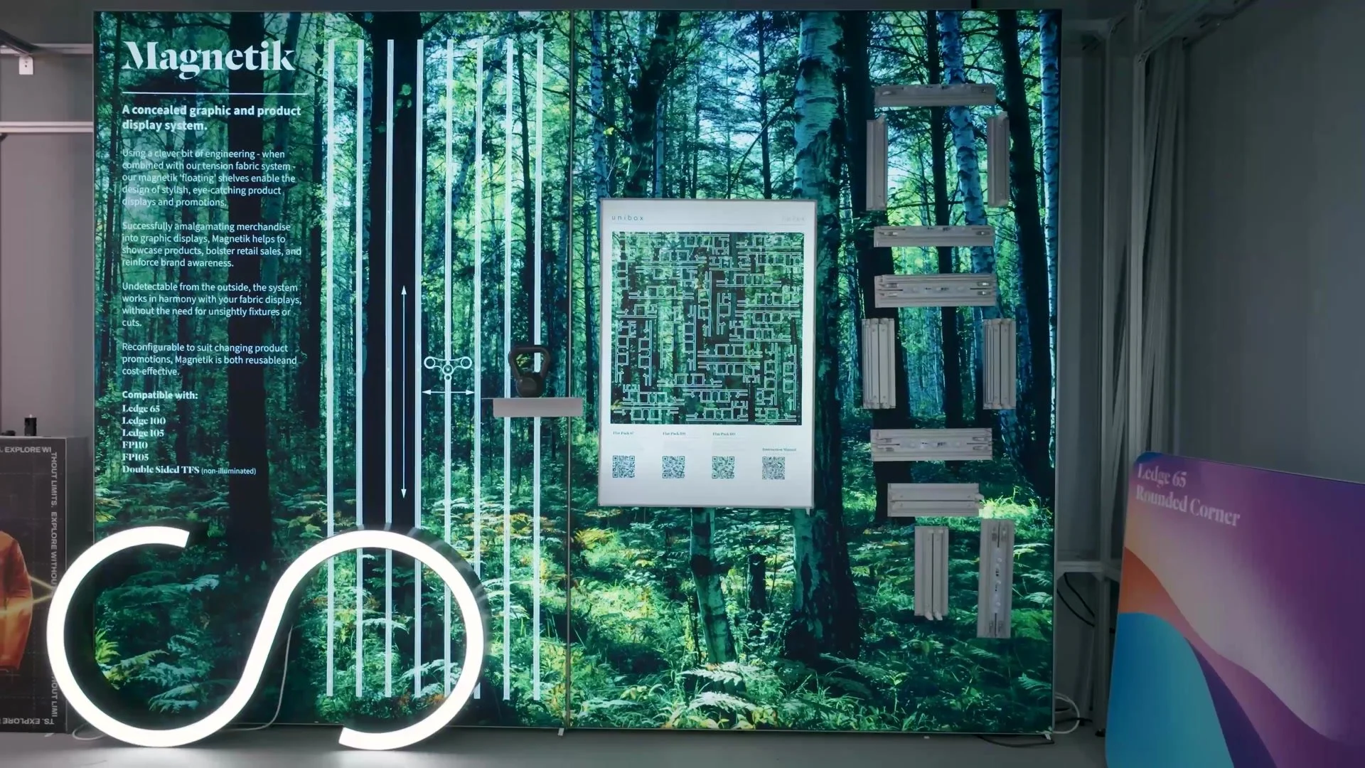 Backlit forest graphic display wall in the Unibox showroom