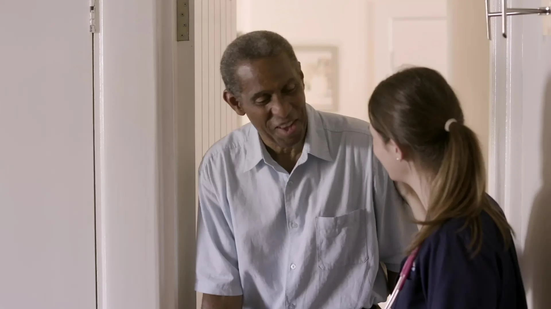 A carer helping a patient at home