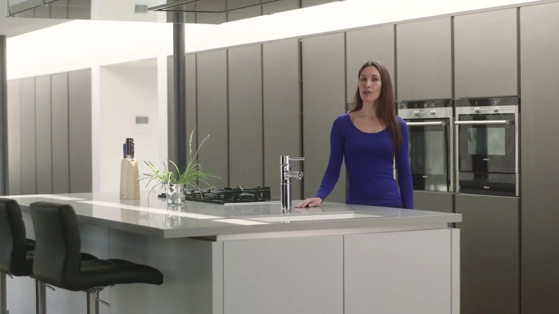 The presenter in the kitchen set