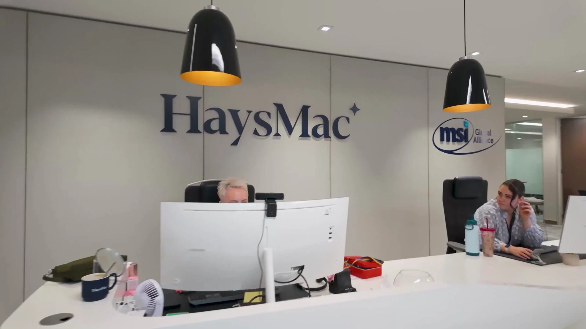 HaysMac reception desk and logo