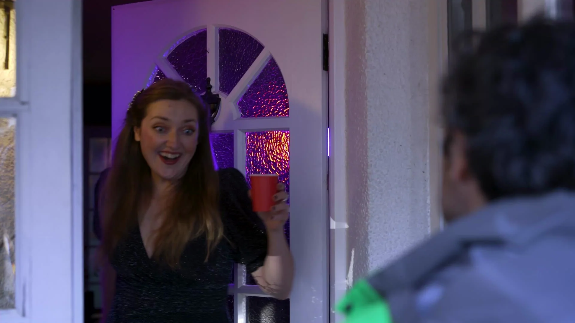 Customer at a party greeting an Uber Eats courier, from the intoxicated customers module