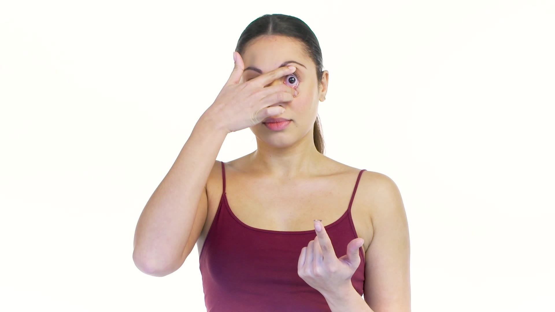 A wearer inserting a contact lens