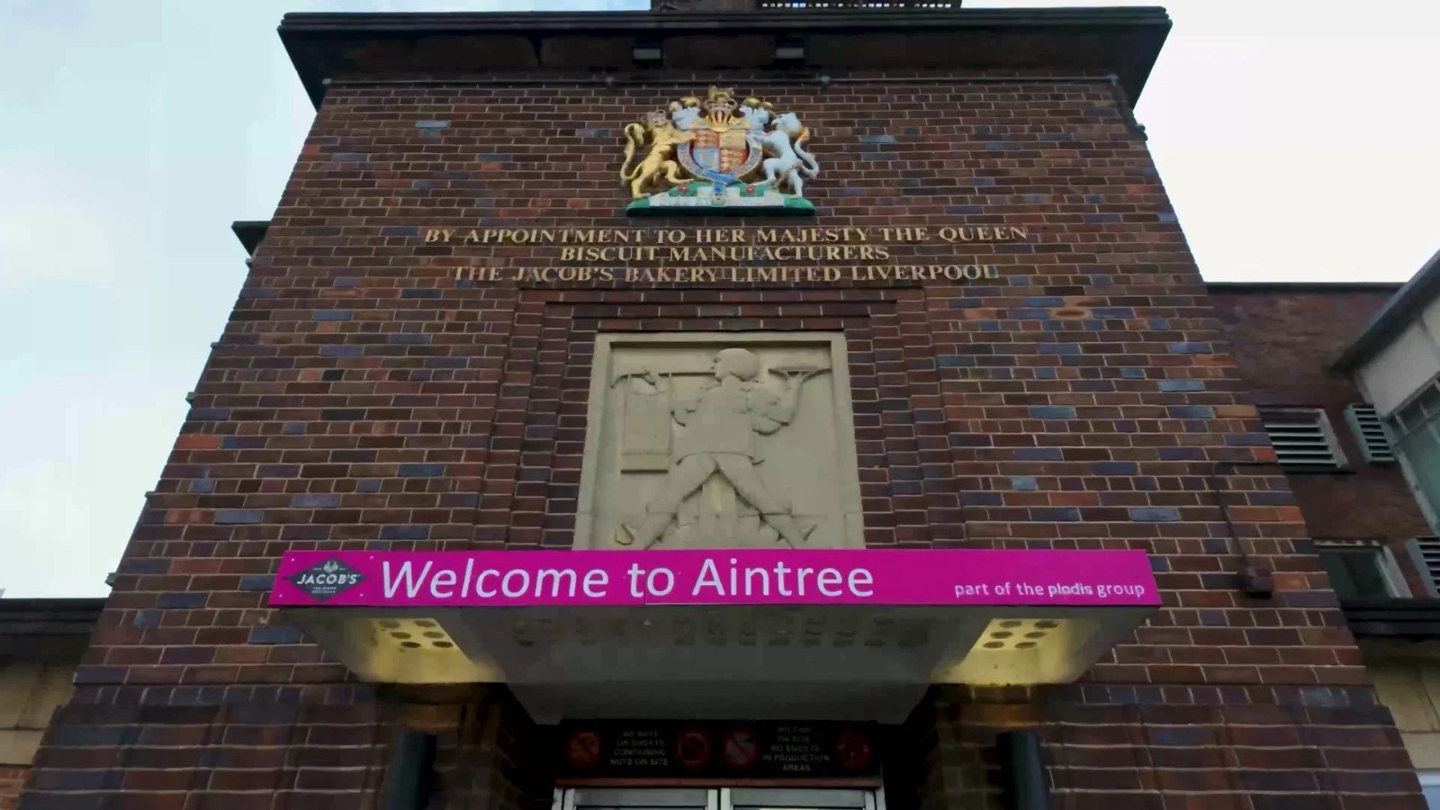 Welcome to Aintree sign on the Jacob's bakery building