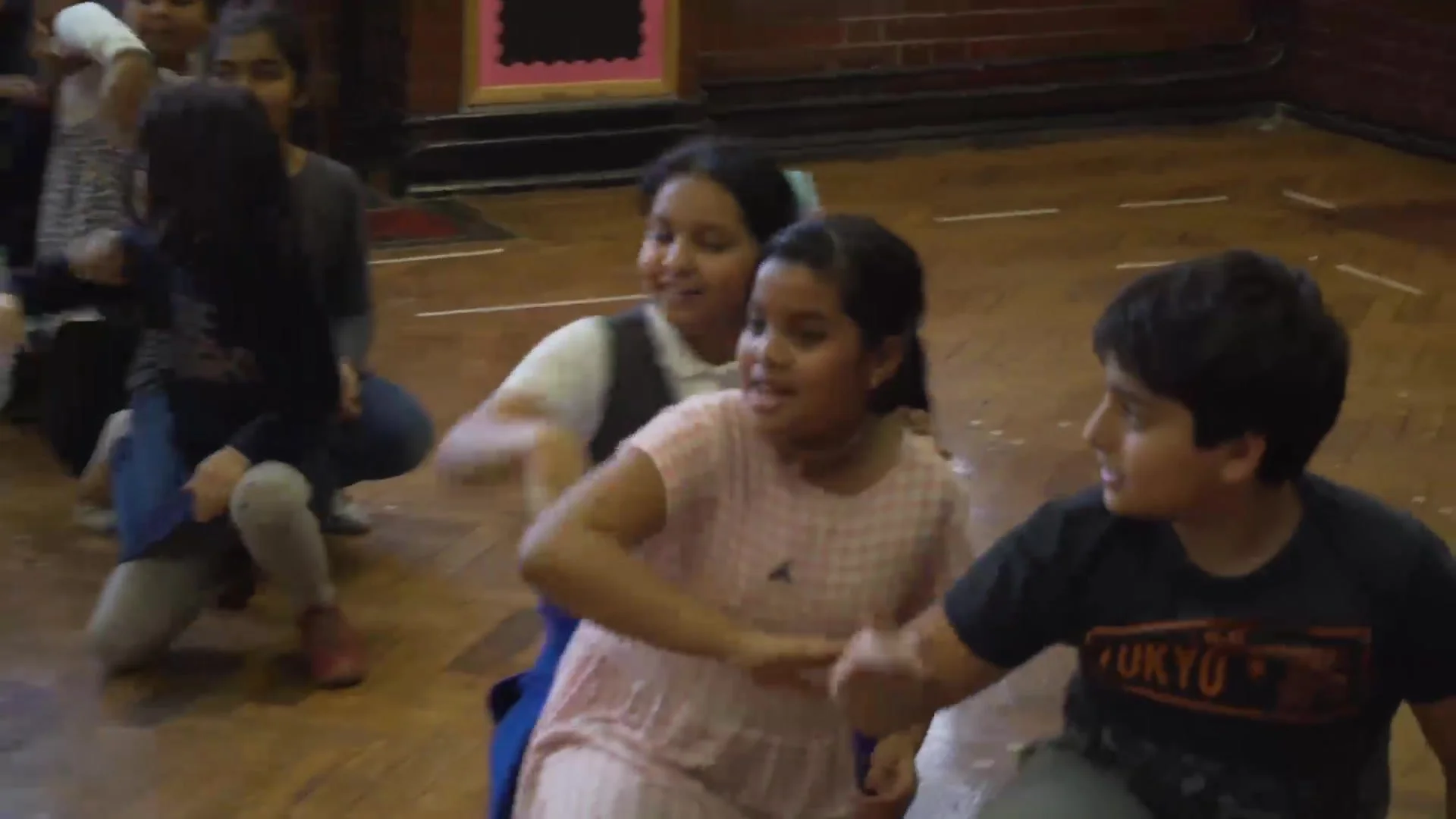Pupils rehearsing in the school hall