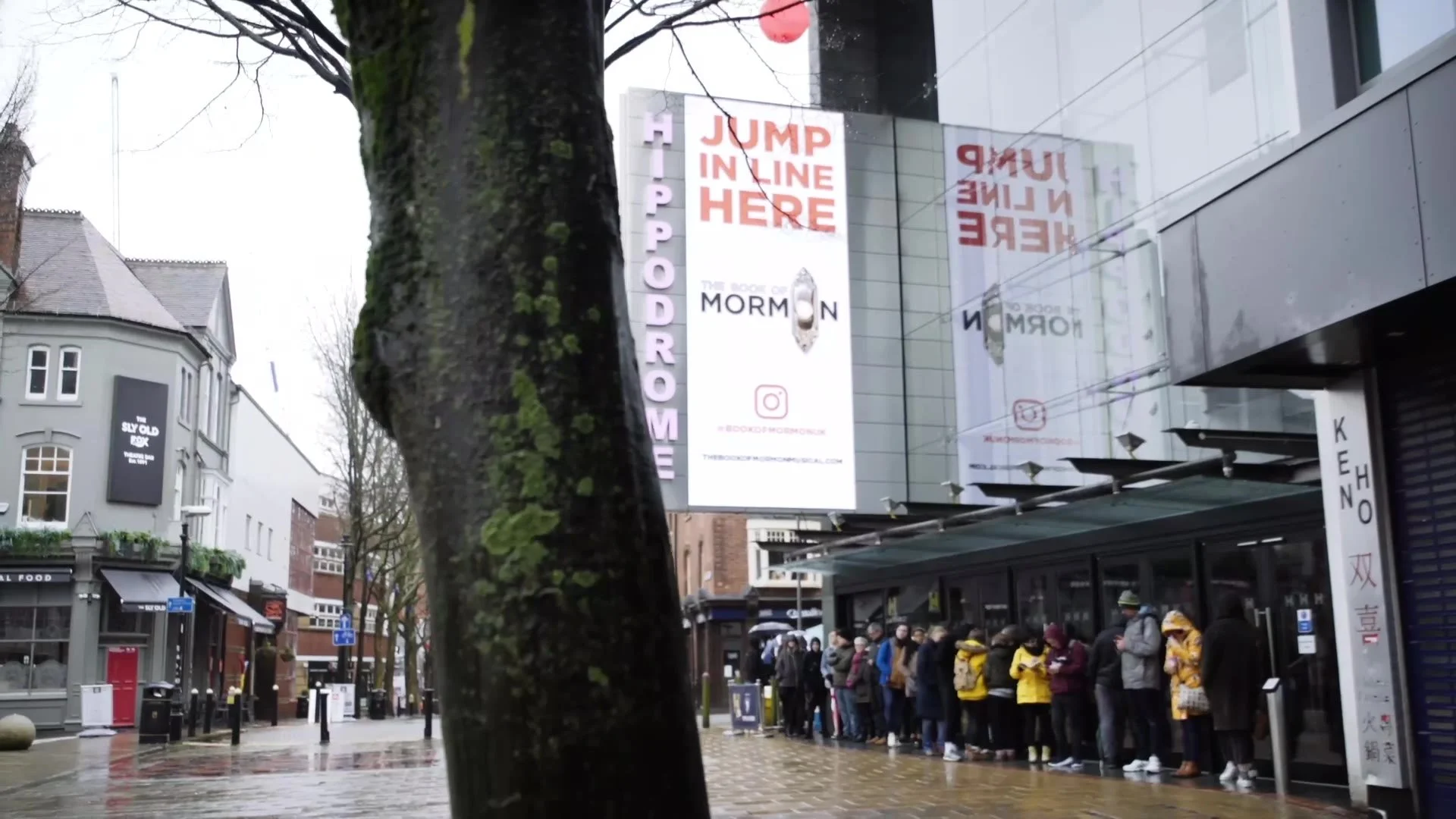 Fans queueing in the rain