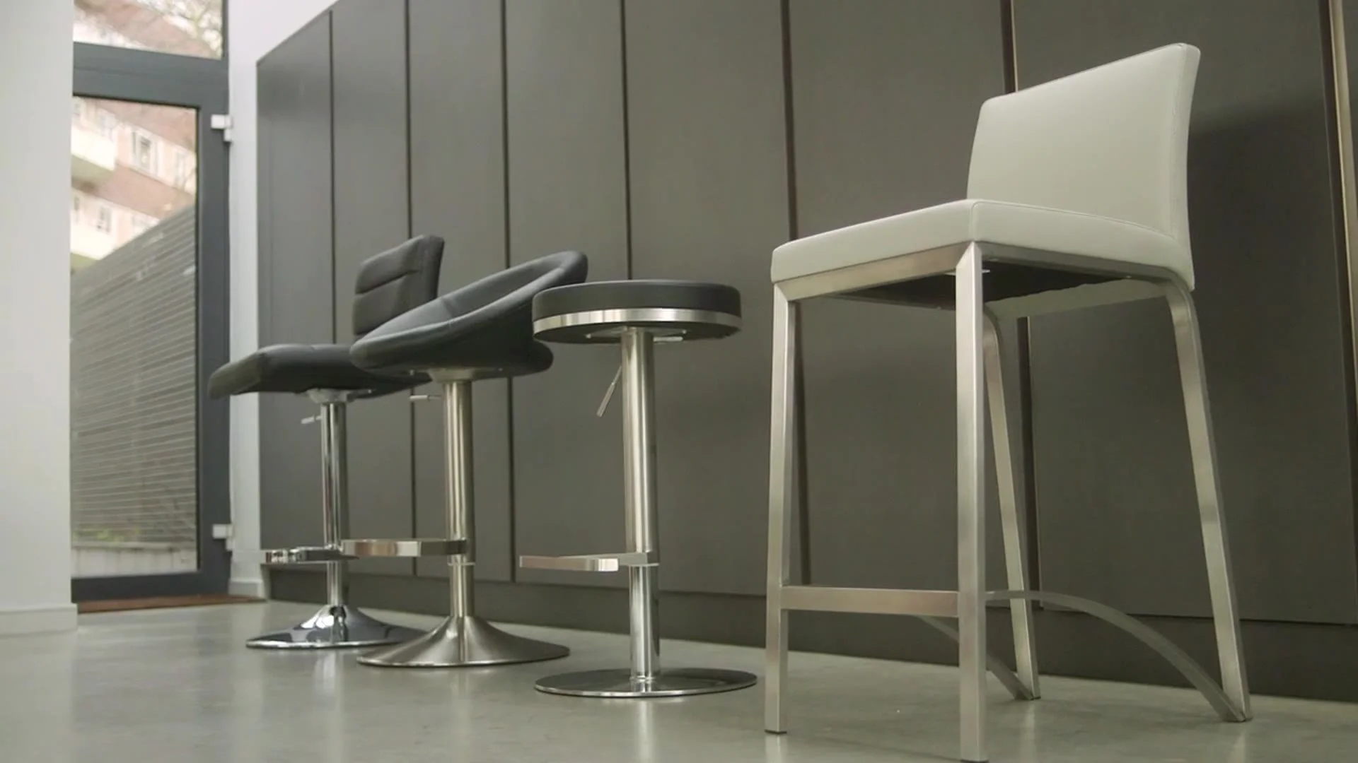 A range of bar stools in a modern kitchen
