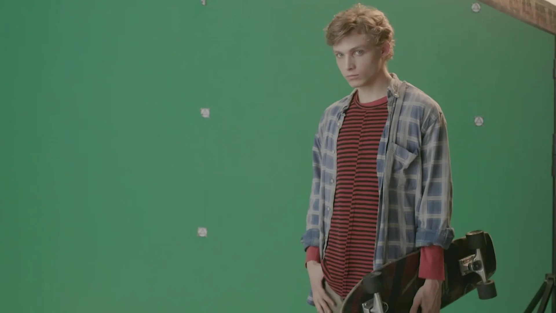 Actor performing in front of a green screen