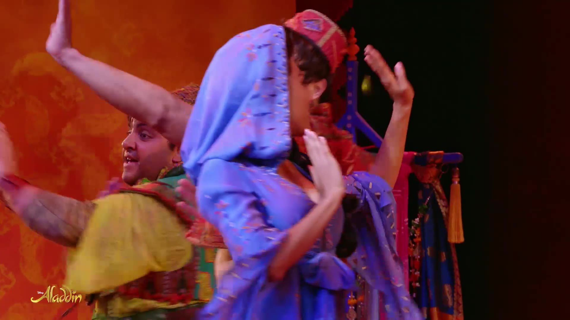 The ensemble performing in the streets of Agrabah