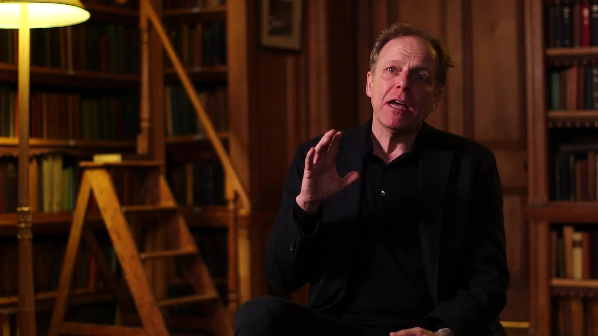 Shakespeare scholar James Shapiro interviewed in a library