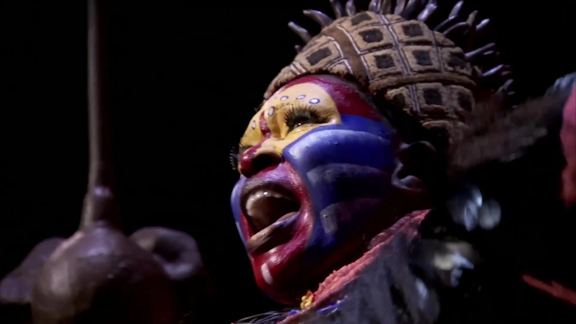 Close-up of Rafiki in full make-up and headdress, from The Lion King documentary