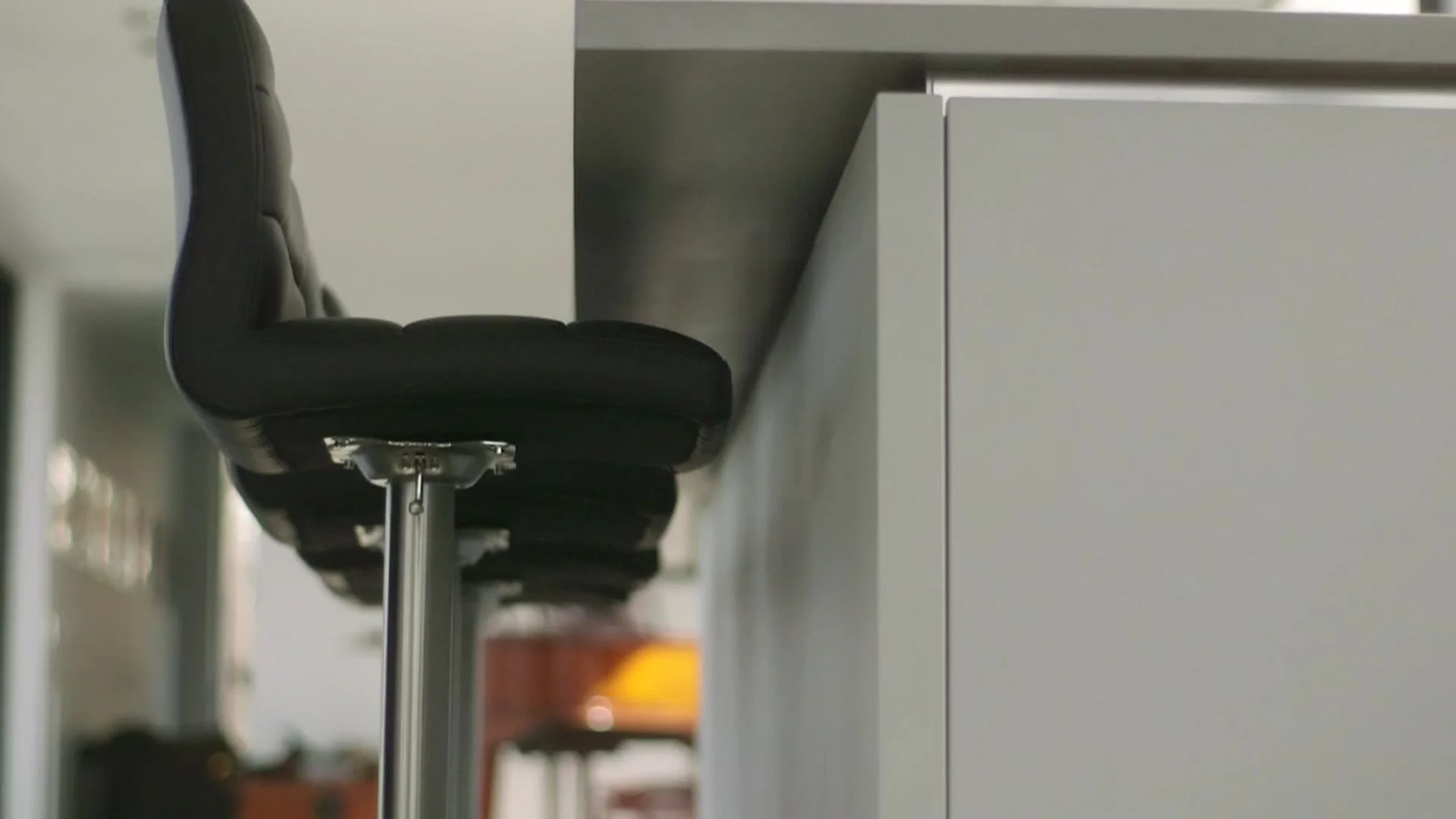 A swivel bar stool at the kitchen island