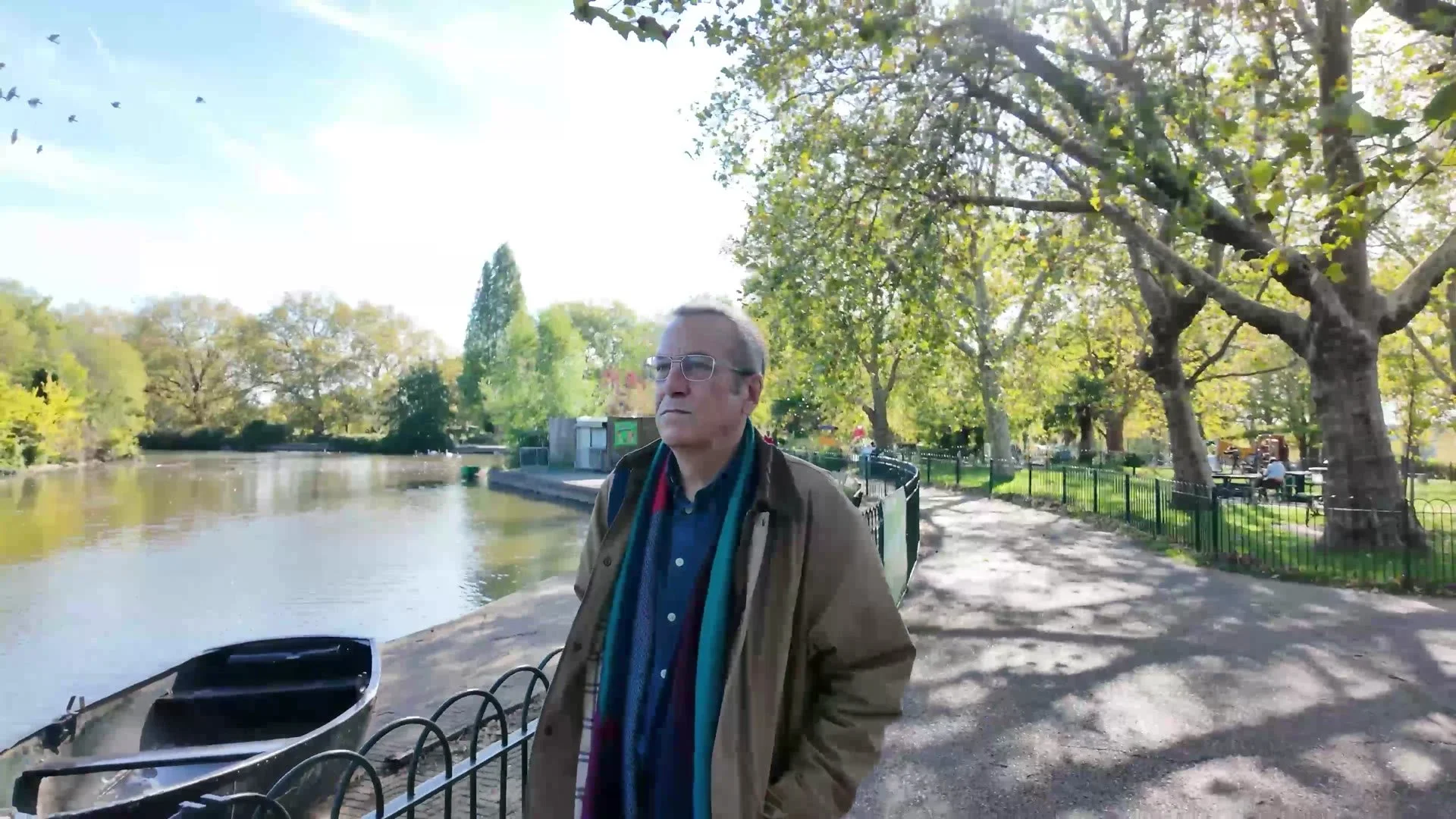 Michael standing by the boating lake