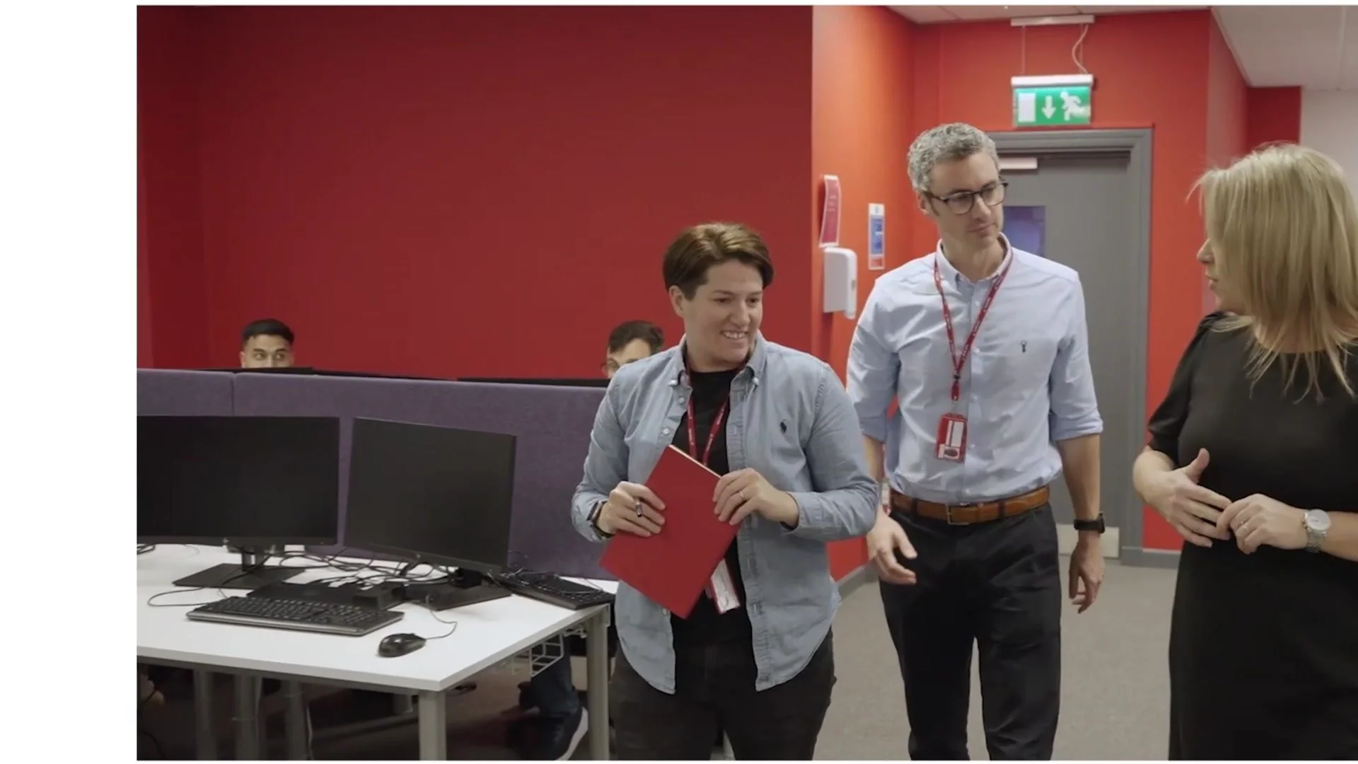 Virgin Atlantic customer centre leaders walking through the office together