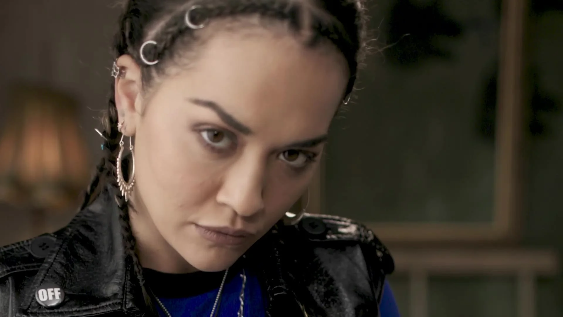 Character with braids in a leather jacket