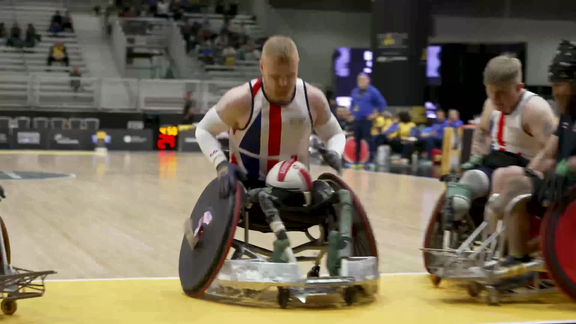 Team UK wheelchair rugby players competing for the ball