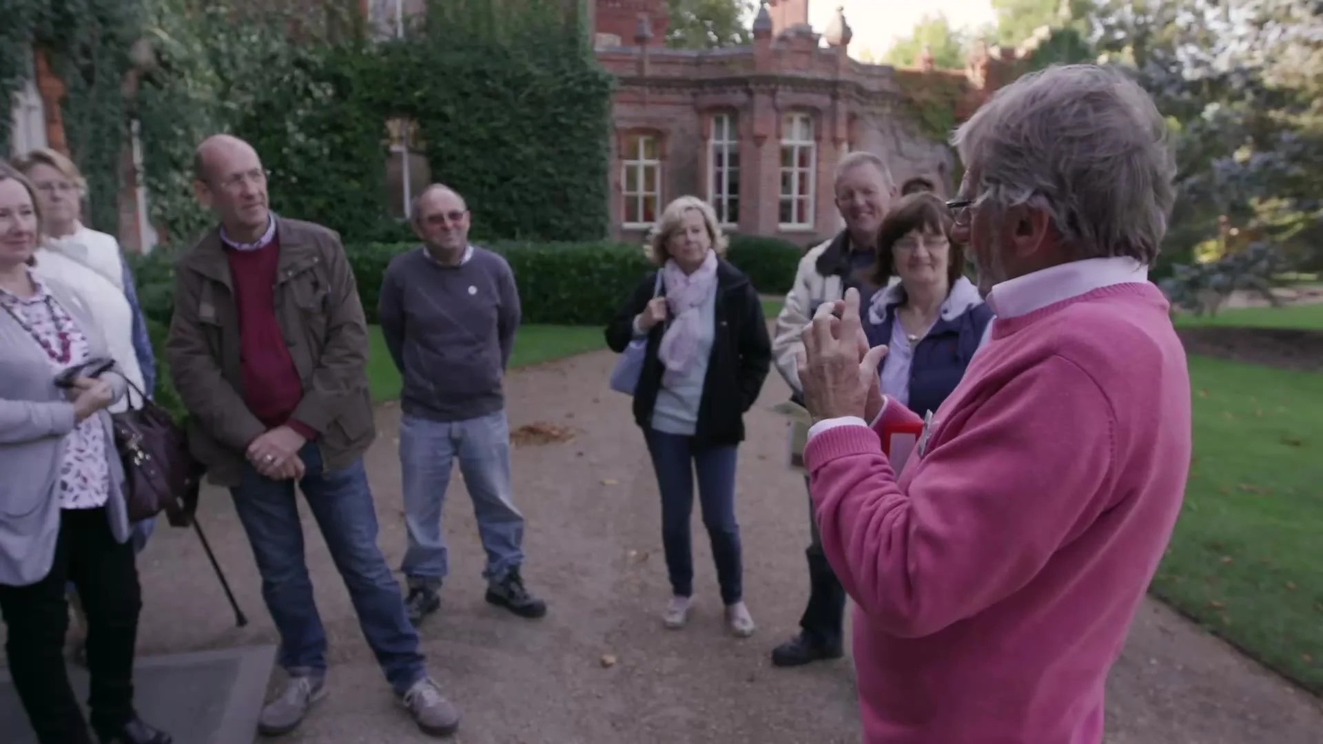 A volunteer guide leading a tour