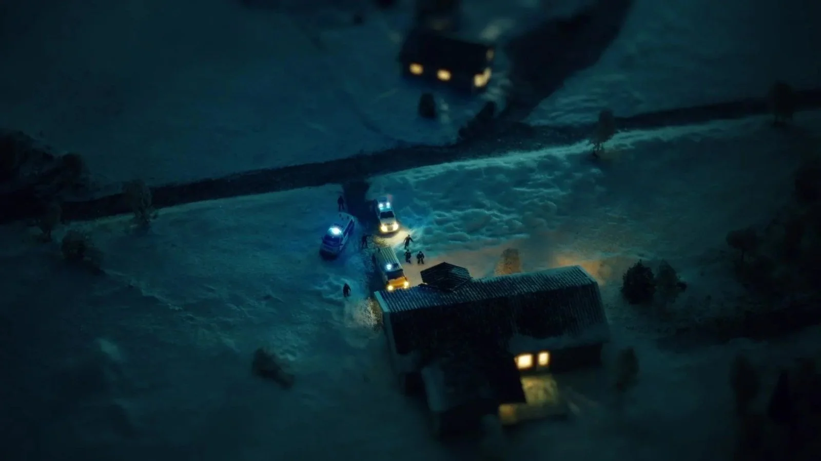 Aerial view of a house at night in the snow, from the HBO documentary trailer