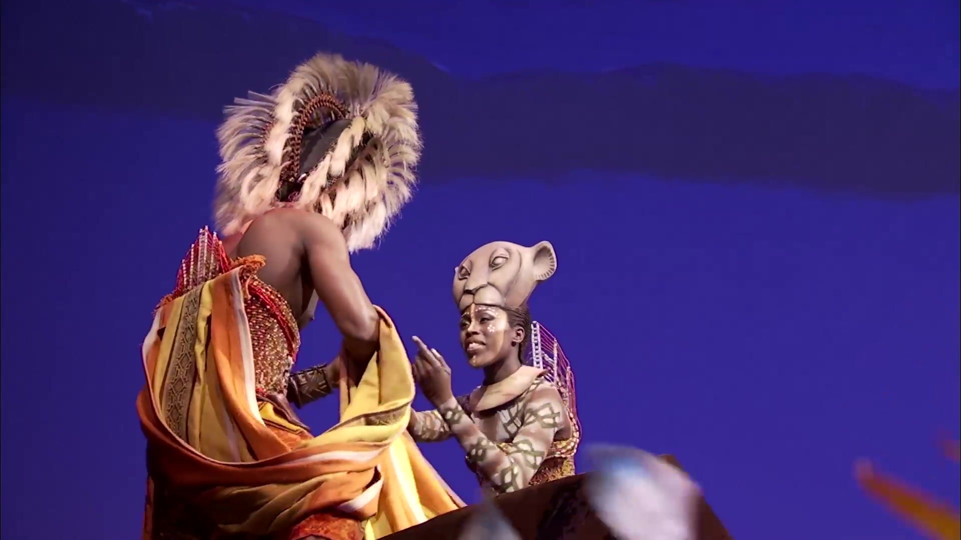 Simba and Nala performing on stage in Disney's The Lion King