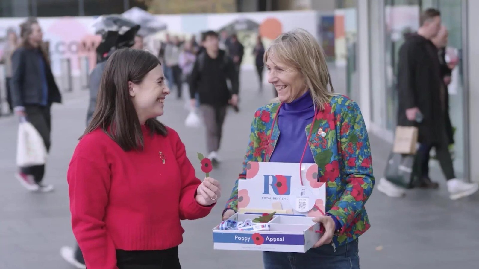 Poppy Appeal volunteers with a collection tray, from the Royal British Legion Poppy Appeal film
