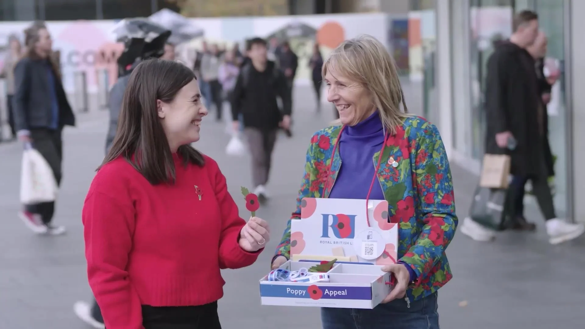 Poppy Appeal volunteers with a collection tray, from the Royal British Legion Poppy Appeal film