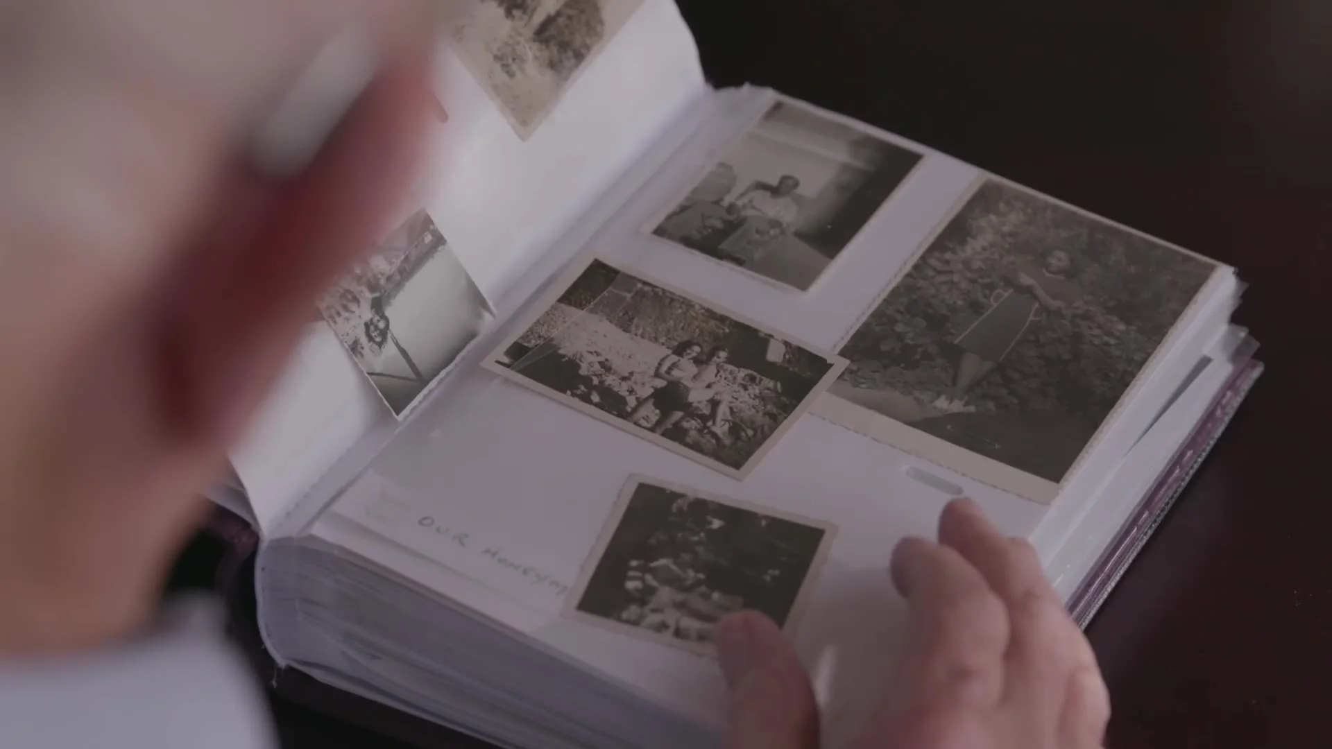 Turning the pages of a family photo album