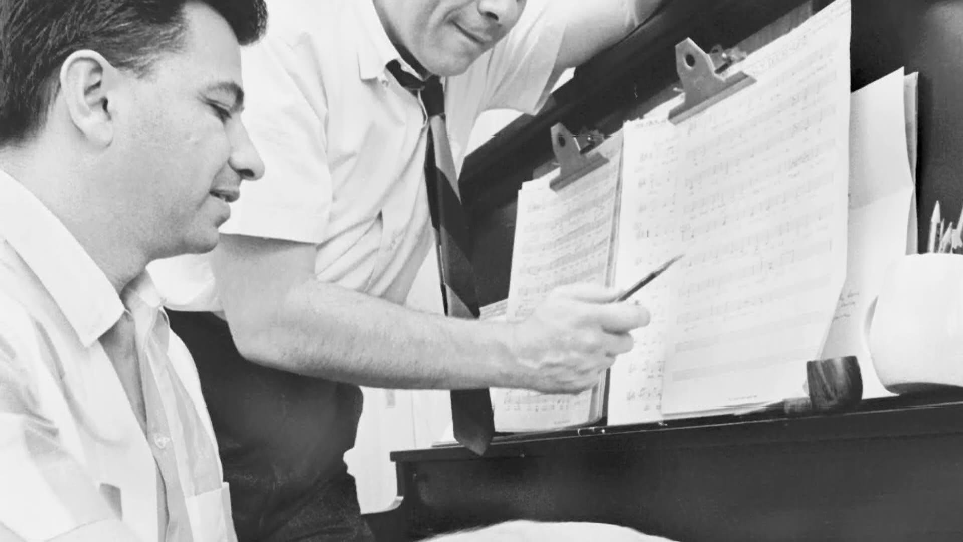 Archive photo of the songwriters at the piano