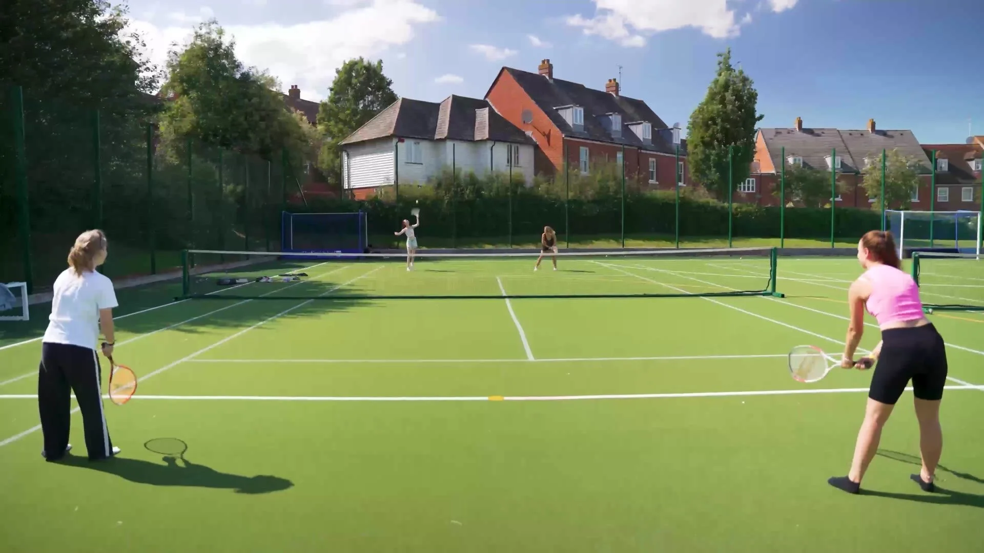 Students playing tennis at a St Giles campus