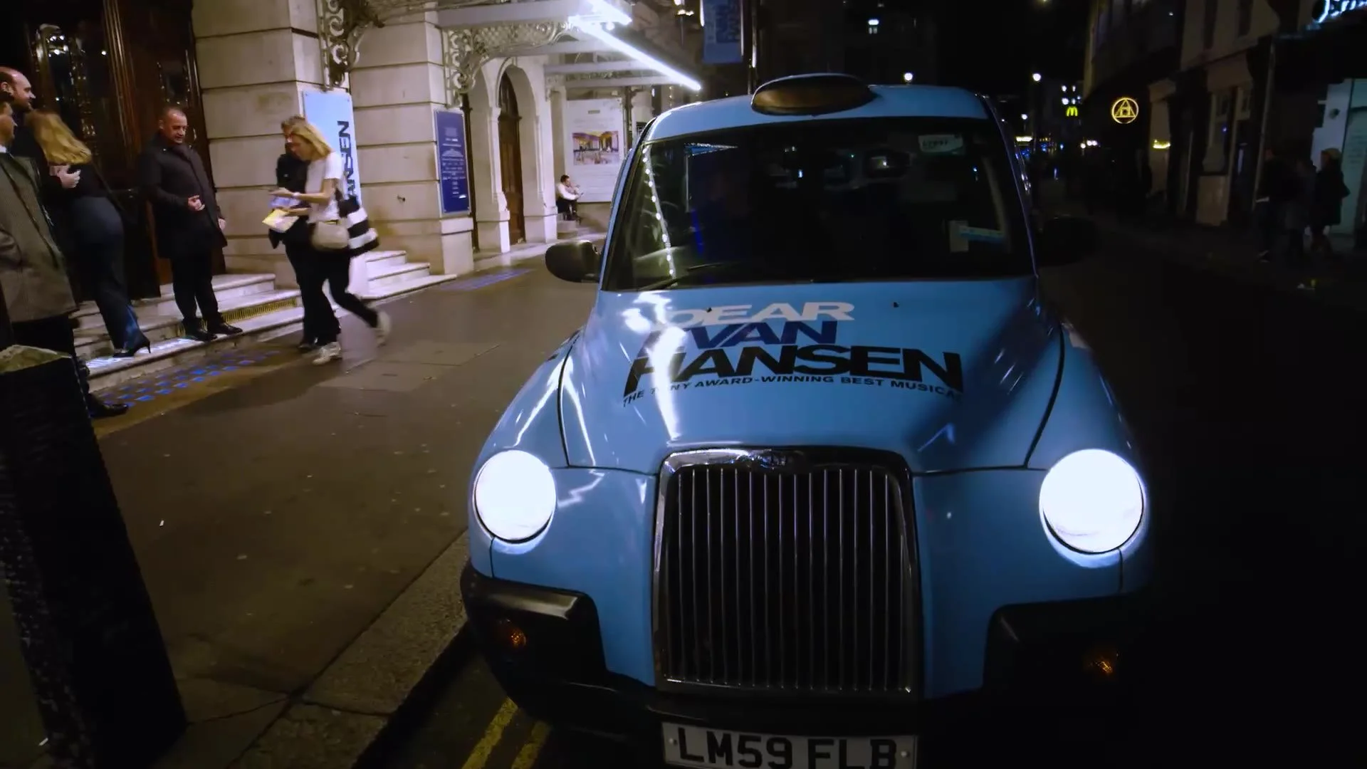 A branded taxi outside the theatre
