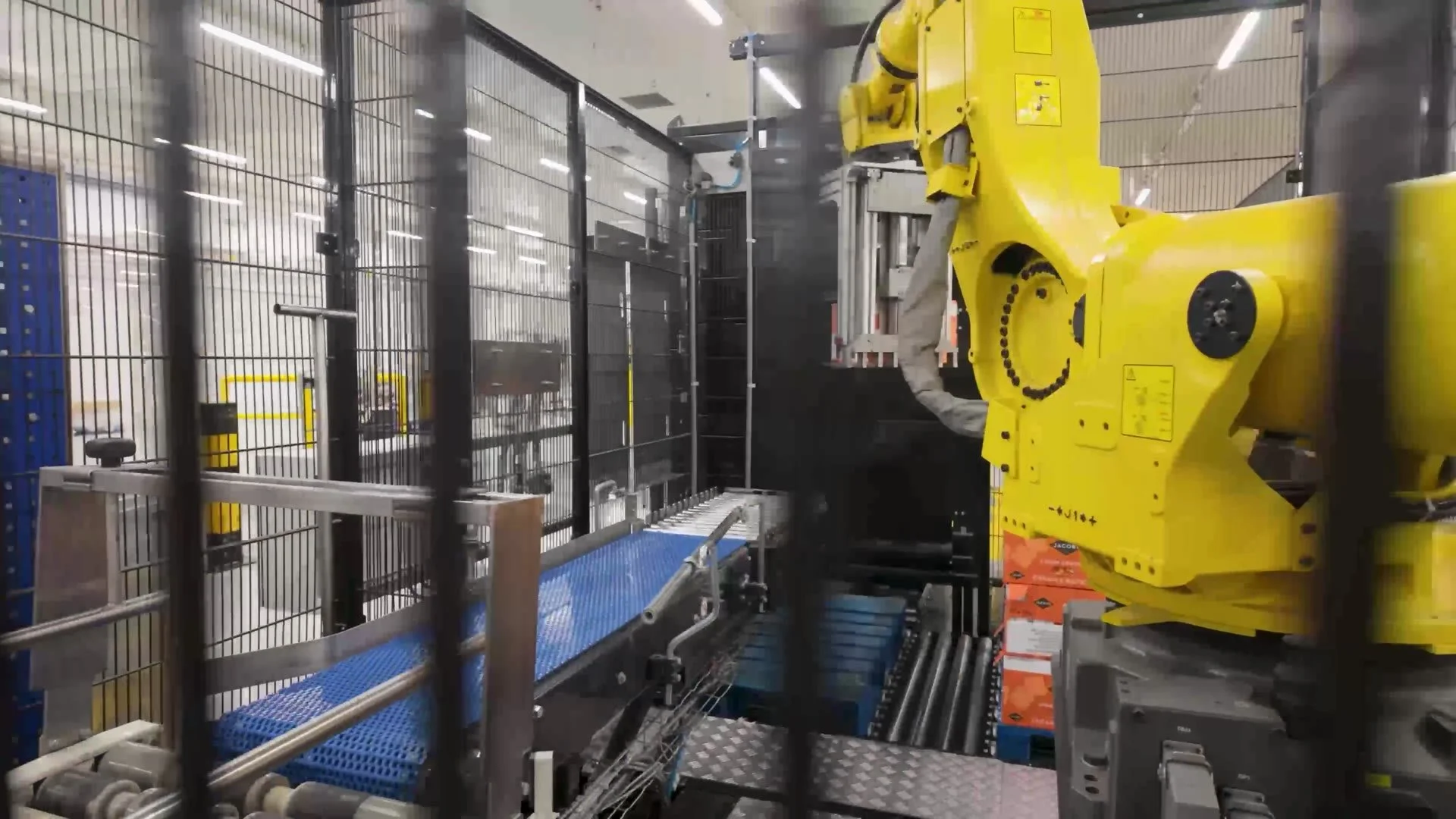 Robotic arm packing products at the Jacob's bakery