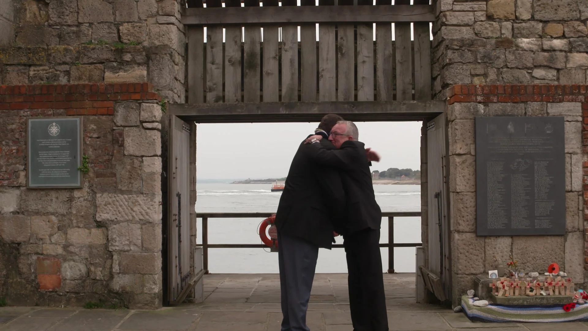 Two Falklands veterans embracing as they meet again