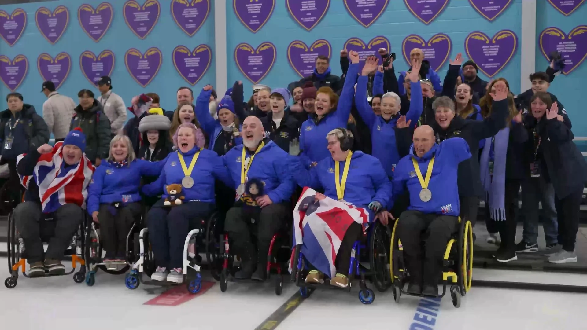 Team UK competitors celebrating with their medals