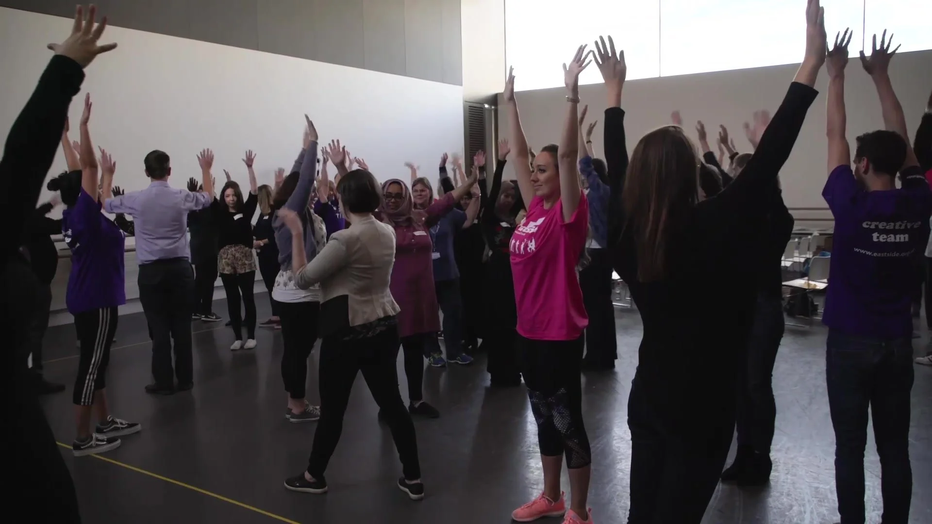 Teachers in a warm-up exercise