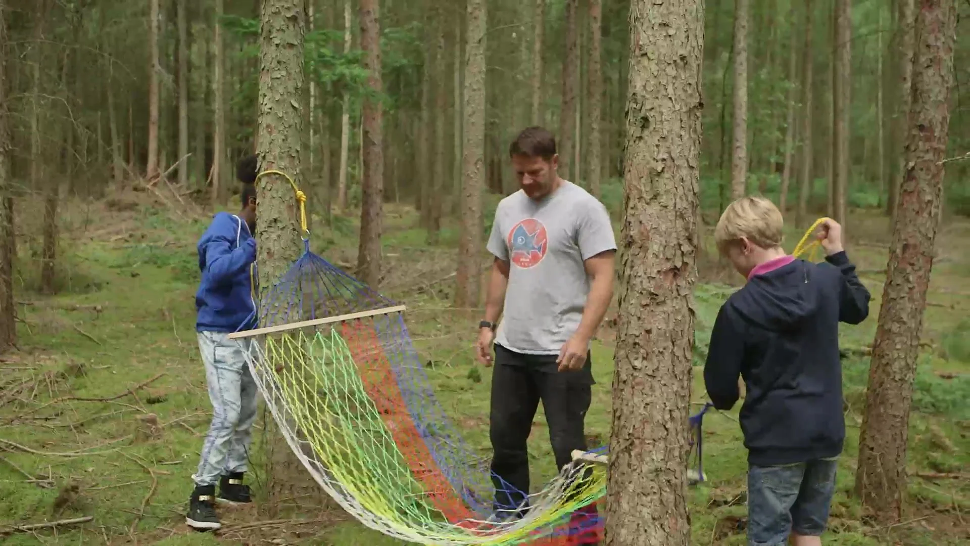 Building a hammock shelter in the woods