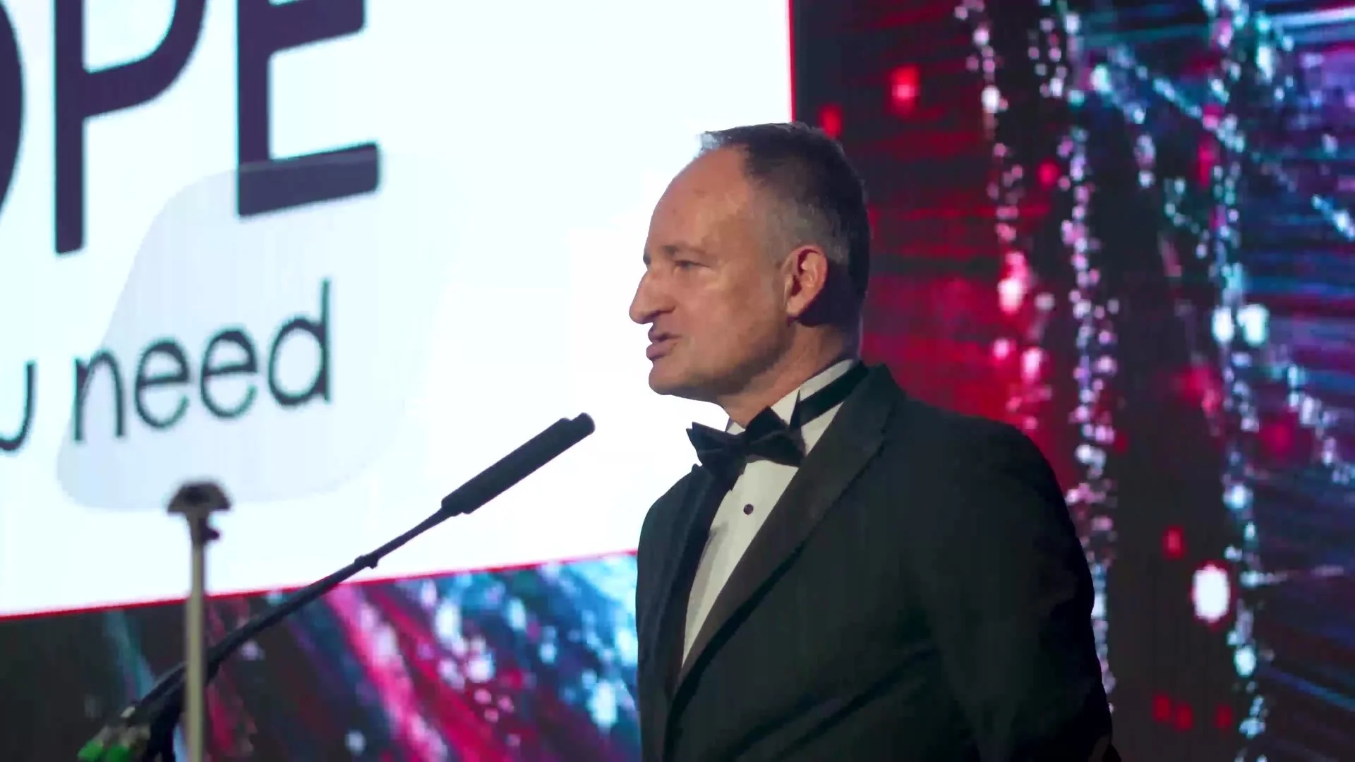 A presenter at the podium