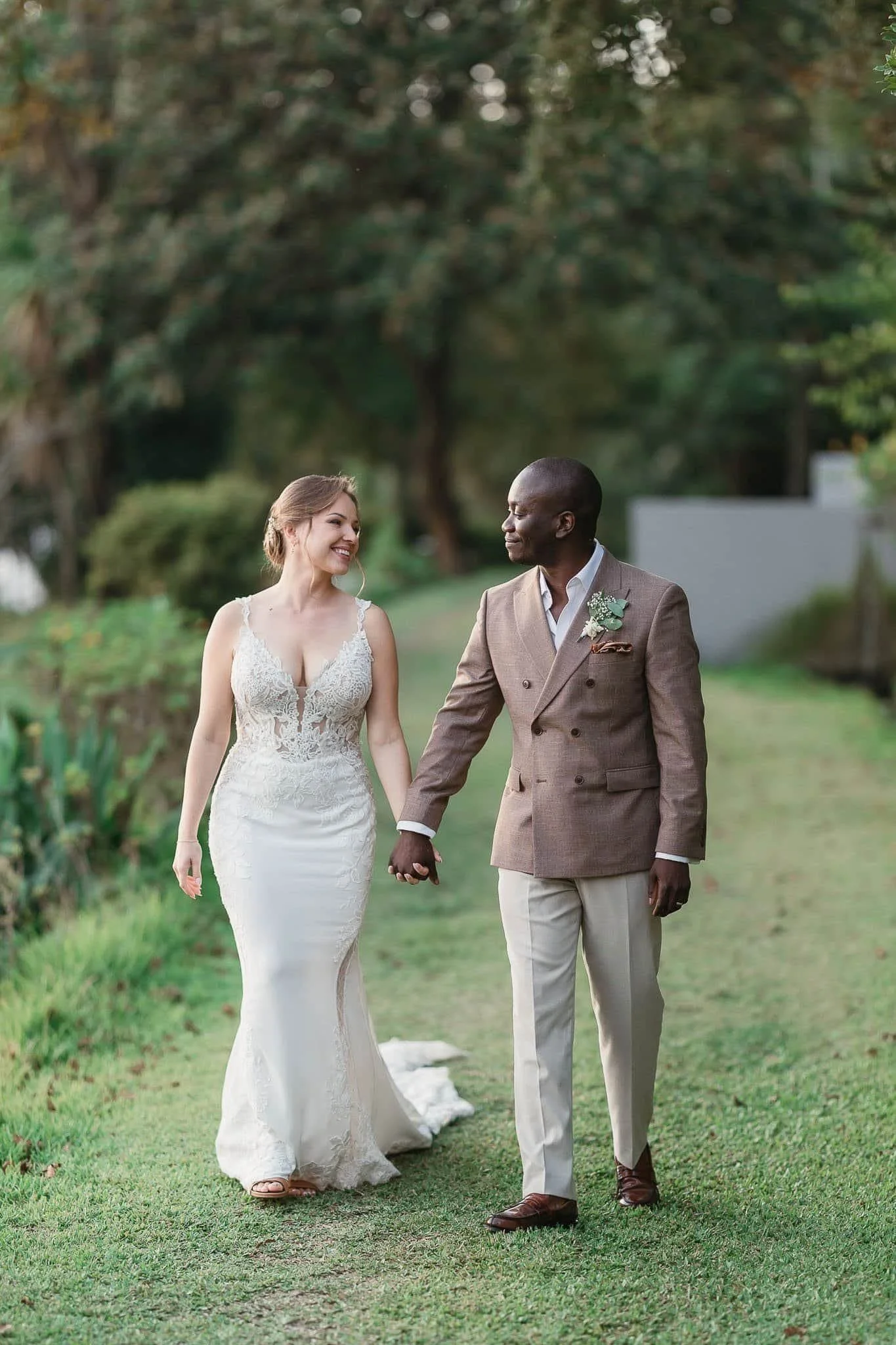 bride and groom in a sunset walking