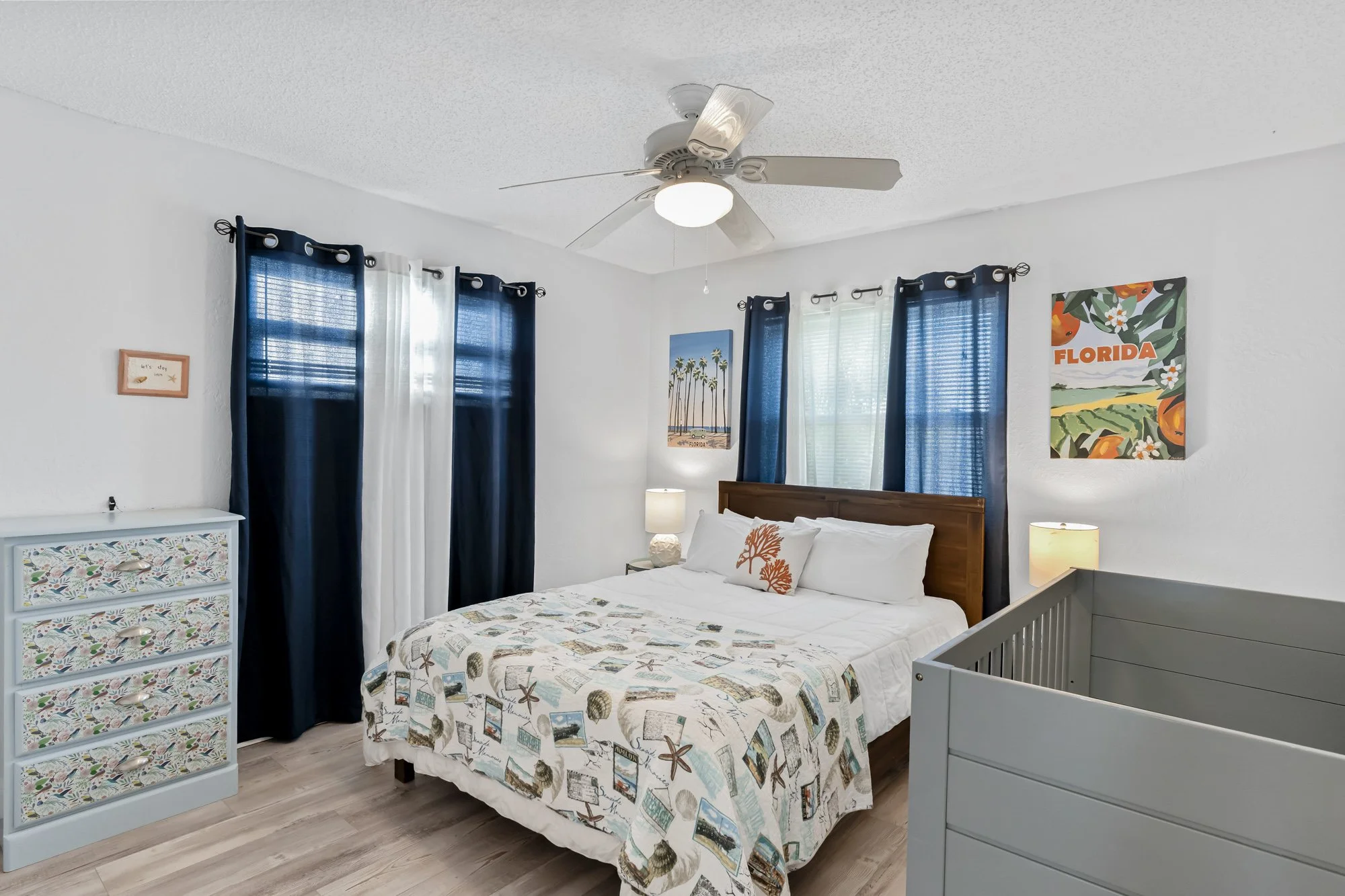 Lower level primary bedroom with crib.