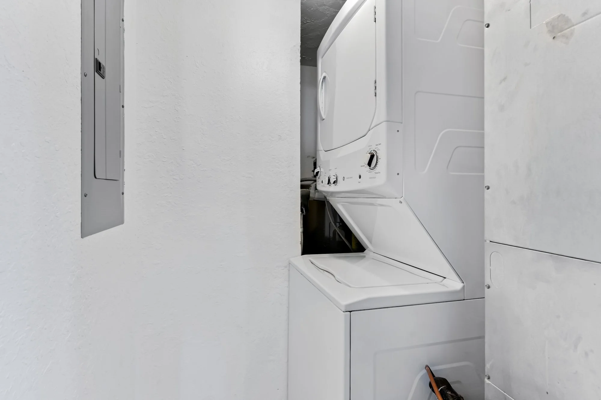 Laundry room in each condo.