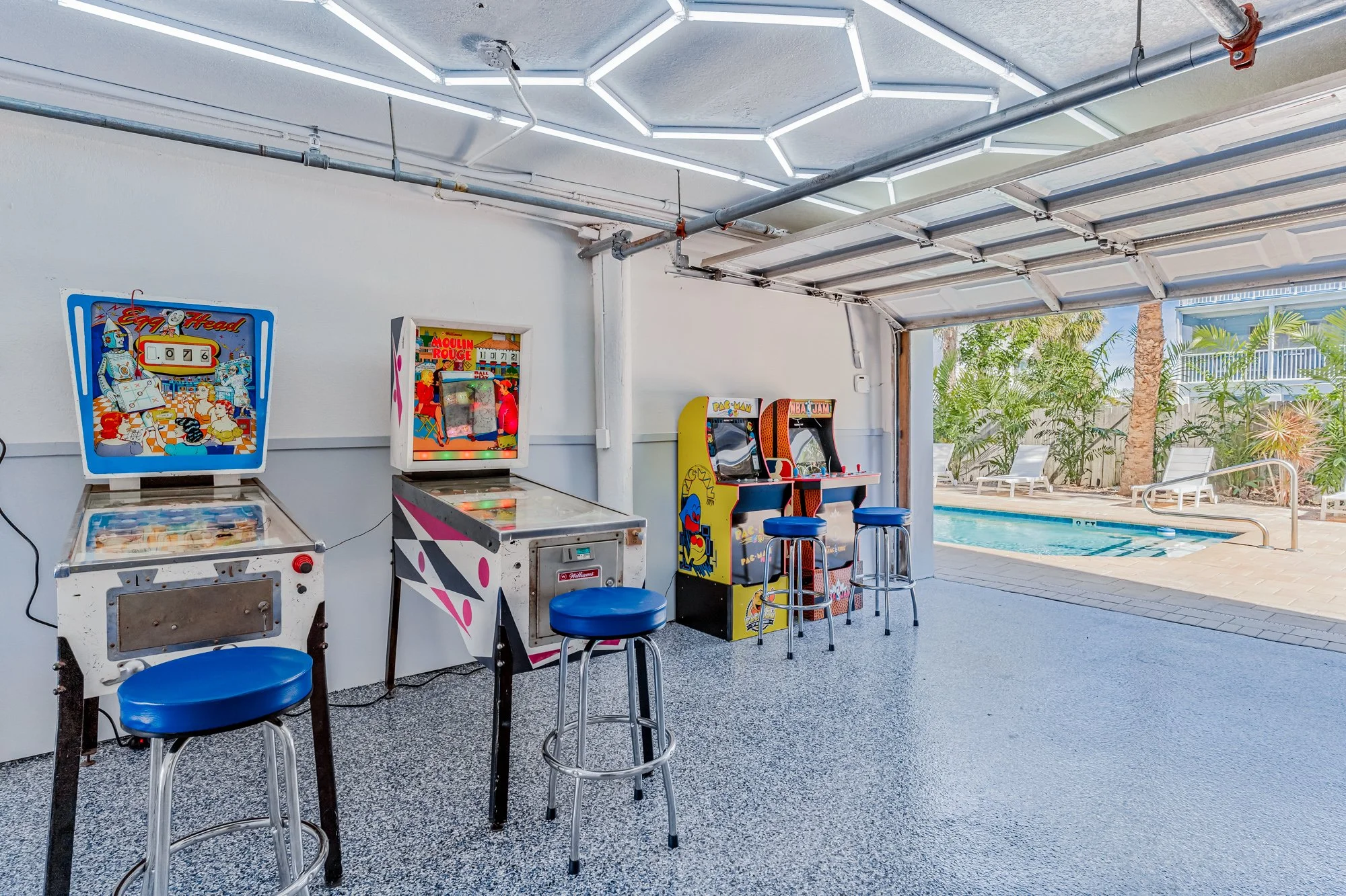 Game room with multiple machines from pinball to video to shuffle board to basketball, Indian Rocks Beach vacation rental