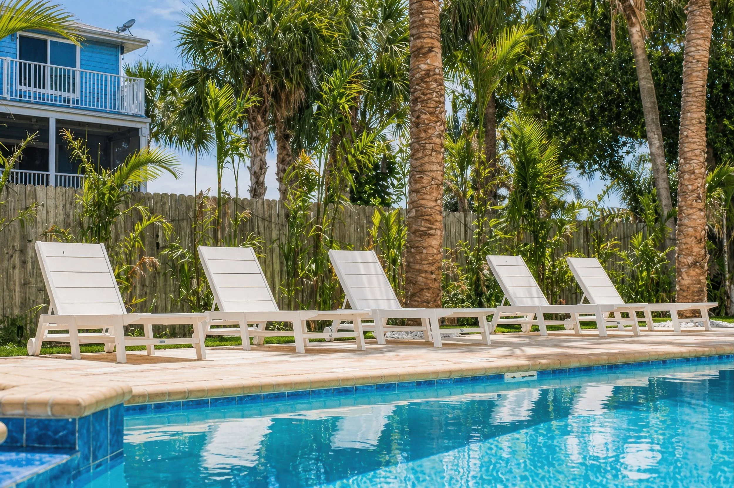 Pool loungers at Condo Del Mar